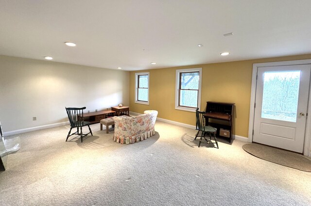 sitting room with light colored carpet, baseboards, and recessed lighting