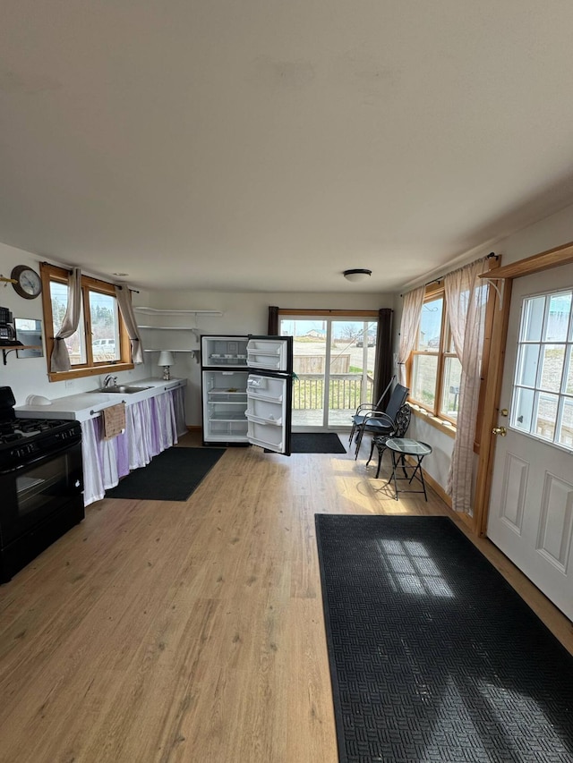 10 Wharf St, Jonesport, ME 04649 - interior space featuring light countertops, wood finished floors, and black range with gas cooktop