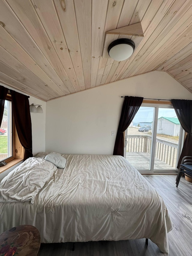 10 Wharf St, Jonesport, ME 04649 - bedroom with lofted ceiling, wood ceiling, access to outside, and wood finished floors