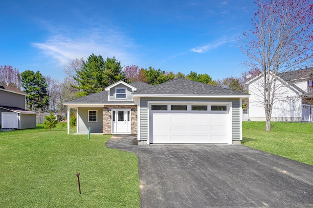 ranch-style home featuring a garage, a front lawn, aphalt driveway, and stone siding