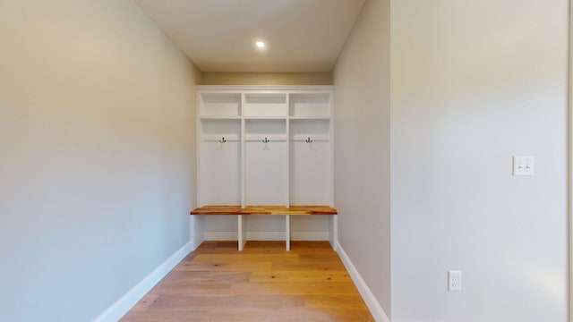mudroom with baseboards, recessed lighting, and light wood-style flooring