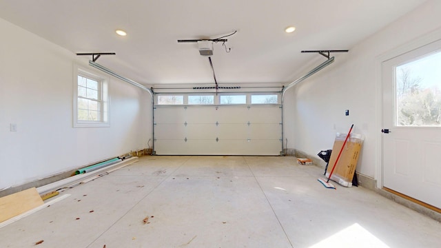 garage featuring a garage door opener and recessed lighting