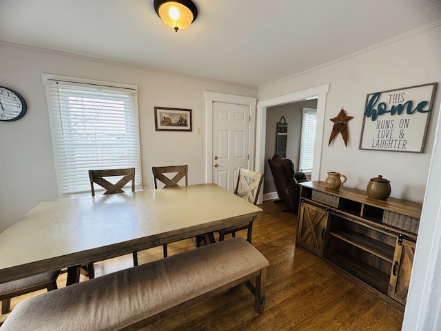 26 Hammond St, Caribou, ME 04736 - dining space featuring crown molding and dark wood-style flooring