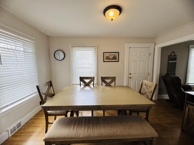 26 Hammond St, Caribou, ME 04736 - dining room with baseboards, wood finished floors, and visible vents