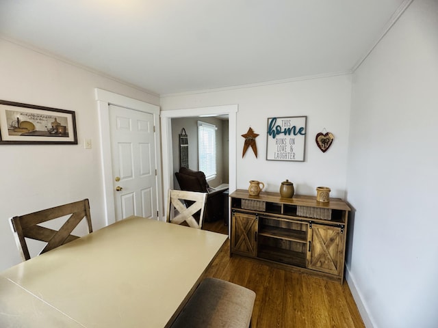 26 Hammond St, Caribou, ME 04736 - dining room with crown molding, baseboards, and dark wood-style floors