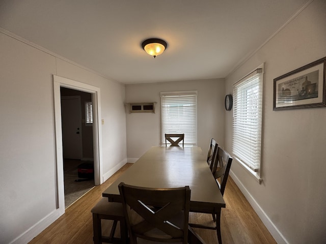 26 Hammond St, Caribou, ME 04736 - dining space with baseboards, crown molding, and wood finished floors