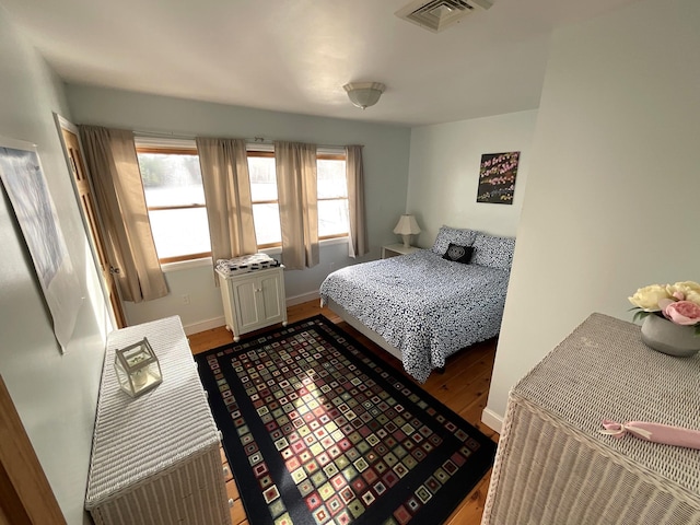 150 Birchwood Rd, Gray, ME 04039 - bedroom with baseboards, wood finished floors, and visible vents