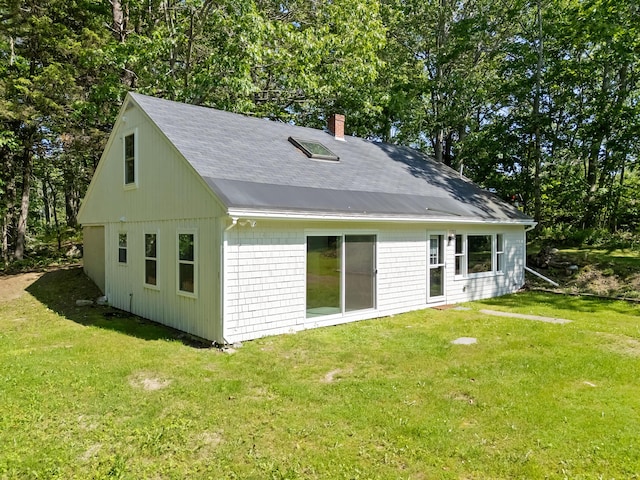 12 Burns Dr, Friendship, ME 04547 - rear view of house featuring a chimney, a yard, and roof with shingles