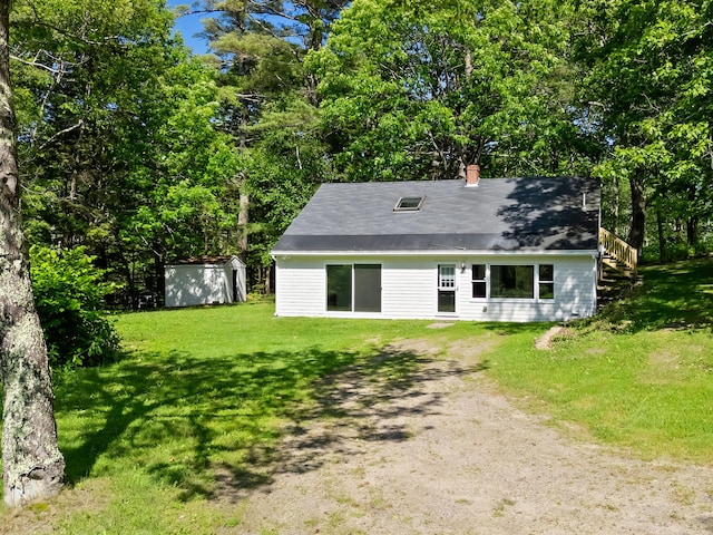 12 Burns Dr, Friendship, ME 04547 - view of front of house with a chimney, dirt driveway, a front yard, and stairway