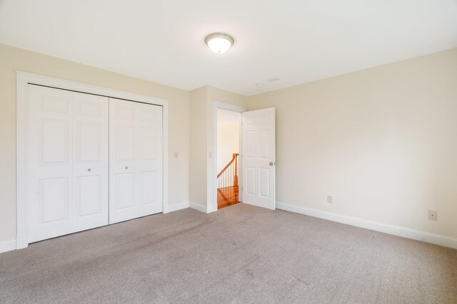 104 Main Trl, Hampden, ME 04444 - unfurnished bedroom featuring carpet, a closet, and baseboards