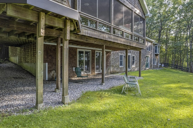 1515 Old Augusta Rd, Waldoboro, ME 04572 - rear view of house featuring a yard and a sunroom