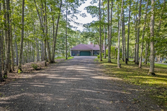 1515 Old Augusta Rd, Waldoboro, ME 04572 - view of front of home with a garage, driveway, and a chimney
