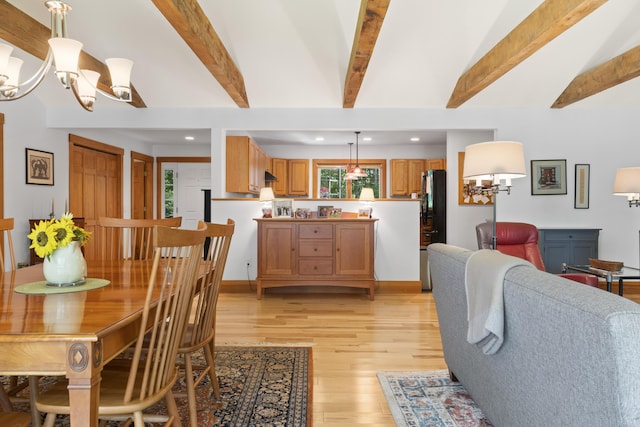 1515 Old Augusta Rd, Waldoboro, ME 04572 - dining room featuring light wood-type flooring, recessed lighting, vaulted ceiling with beams, and an inviting chandelier