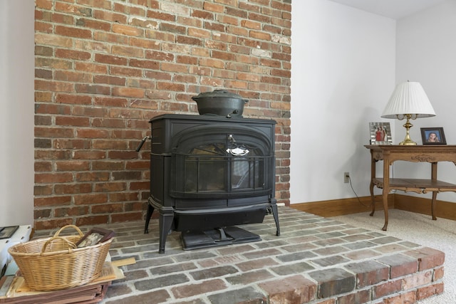 1515 Old Augusta Rd, Waldoboro, ME 04572 - details with baseboards and a wood stove