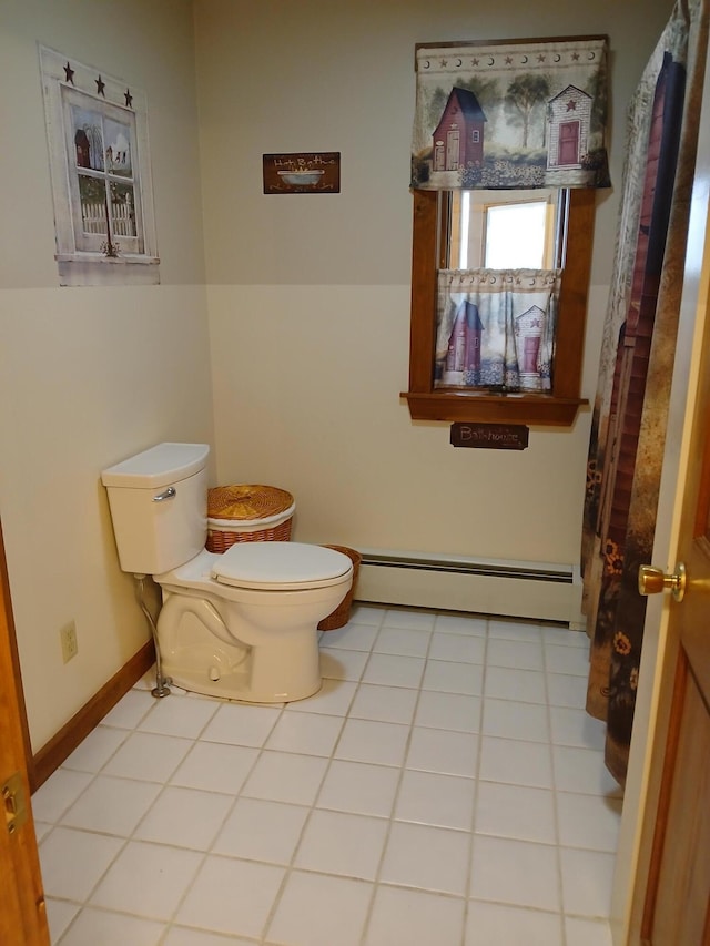bathroom with toilet, tile patterned flooring, baseboards, and a baseboard heating unit
