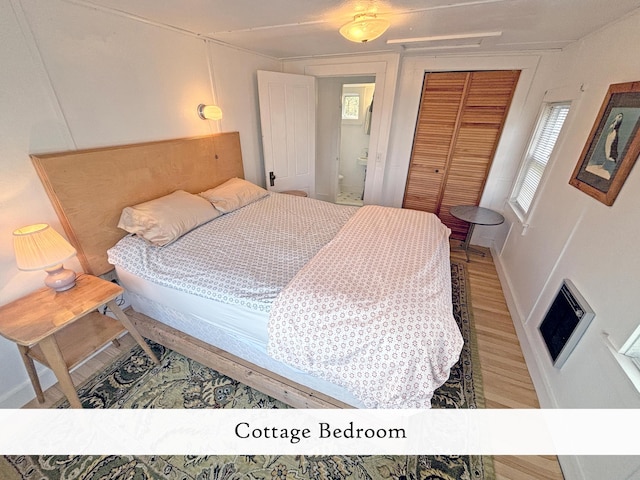 bedroom featuring a closet, baseboards, and wood finished floors