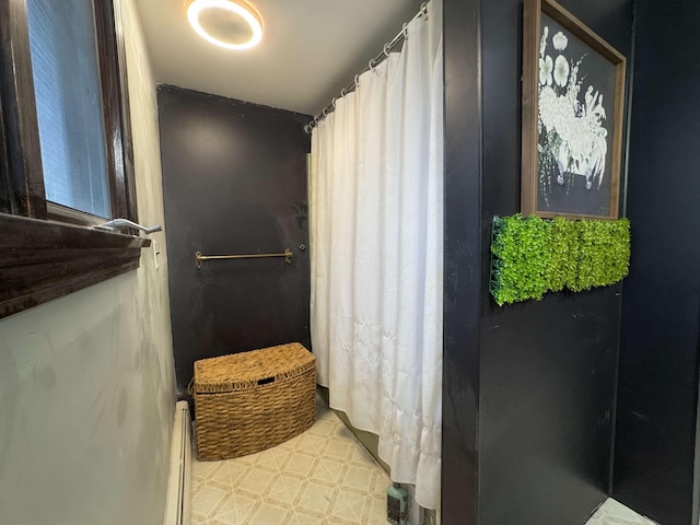 bathroom featuring a shower with shower curtain