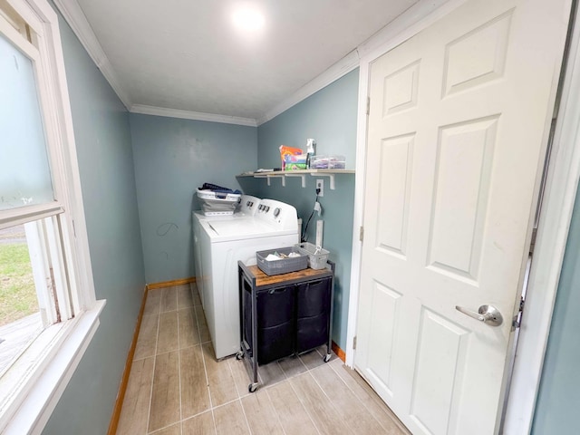 laundry room with washer and dryer, laundry area, light wood-style flooring, baseboards, and ornamental molding
