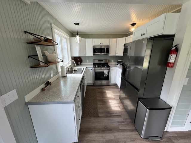 6 Gully Brook Ln, Orland, ME 04472 - kitchen with appliances with stainless steel finishes, a sink, open shelves, white cabinetry, and dark wood-style floors