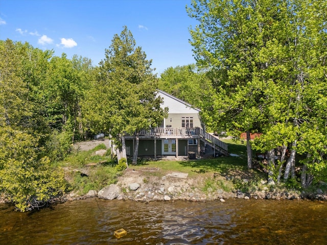 32 Whites Pond Rd, Palmyra, ME 04965 - back of house with french doors, a deck with water view, and stairs