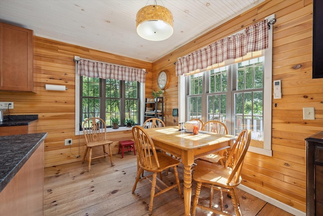 32 Whites Pond Rd, Palmyra, ME 04965 - dining room featuring light wood finished floors and wooden walls