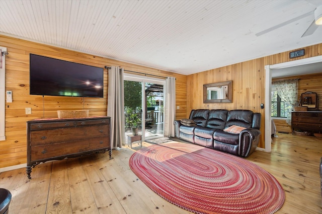 32 Whites Pond Rd, Palmyra, ME 04965 - living room featuring hardwood / wood-style floors, wooden walls, a ceiling fan, and wooden ceiling