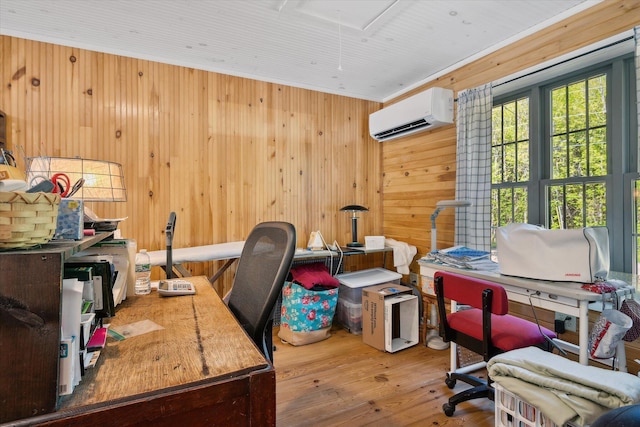 32 Whites Pond Rd, Palmyra, ME 04965 - home office with a wall unit AC, attic access, hardwood / wood-style floors, and wood walls