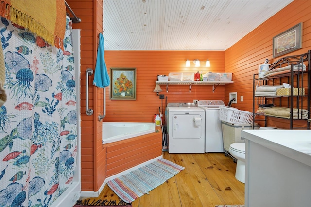 32 Whites Pond Rd, Palmyra, ME 04965 - bathroom featuring separate washer and dryer, wood-type flooring, a shower stall, toilet, and vanity