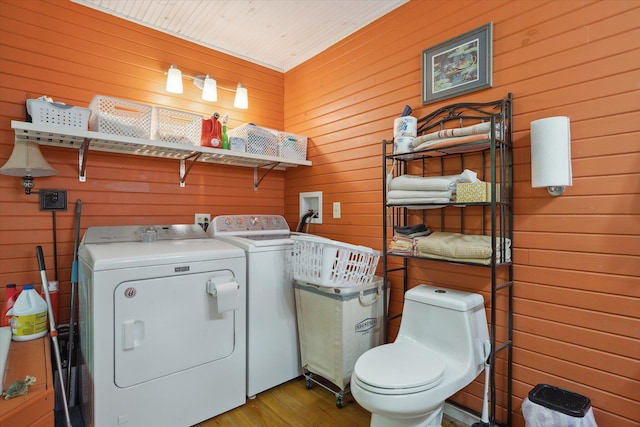 32 Whites Pond Rd, Palmyra, ME 04965 - laundry room featuring washer and dryer, wooden walls, and wood finished floors