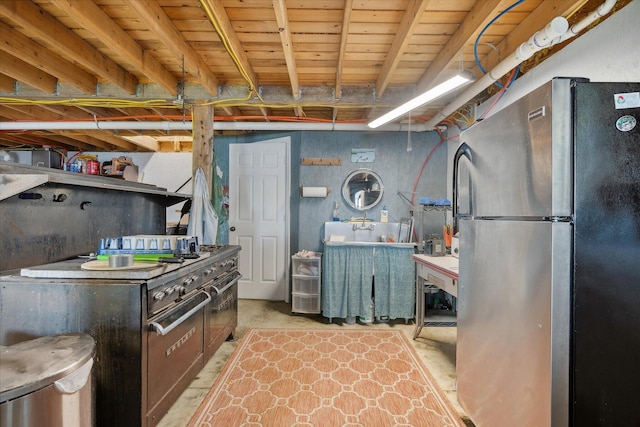 32 Whites Pond Rd, Palmyra, ME 04965 - kitchen featuring freestanding refrigerator and concrete floors