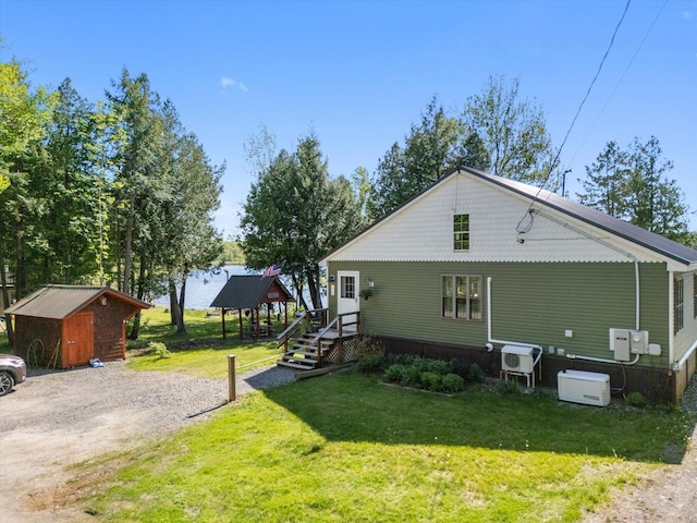 32 Whites Pond Rd, Palmyra, ME 04965 - view of side of property featuring a gazebo, a yard, and an outdoor structure