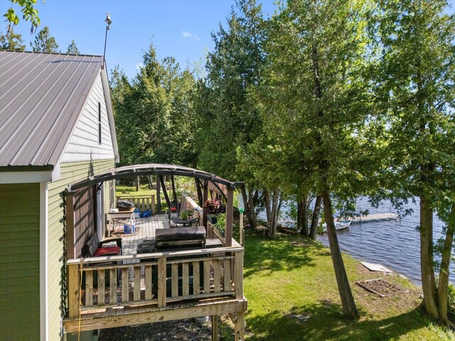 32 Whites Pond Rd, Palmyra, ME 04965 - view of grassy yard featuring a deck with water view