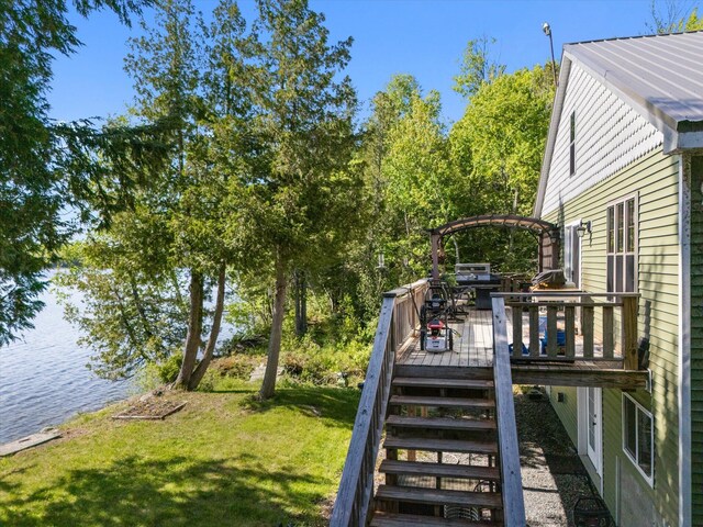 32 Whites Pond Rd, Palmyra, ME 04965 - view of grassy yard featuring a deck with water view and stairway