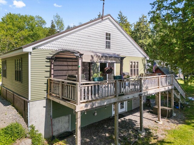 32 Whites Pond Rd, Palmyra, ME 04965 - back of property with a deck