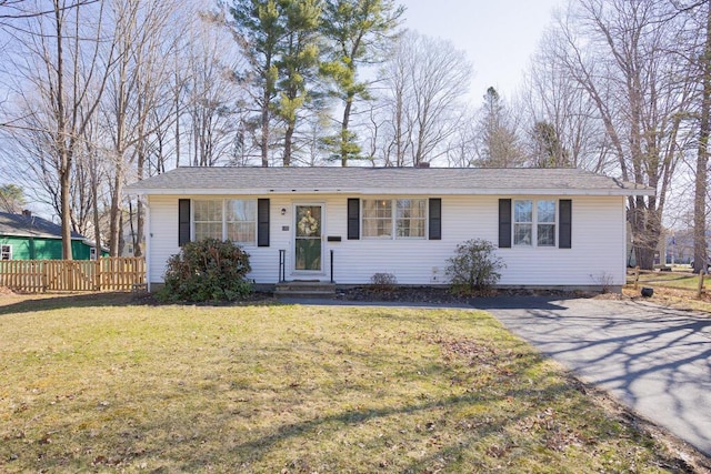 107 Elm St, Farmington, ME 04938 - single story home featuring a front yard, fence, and entry steps