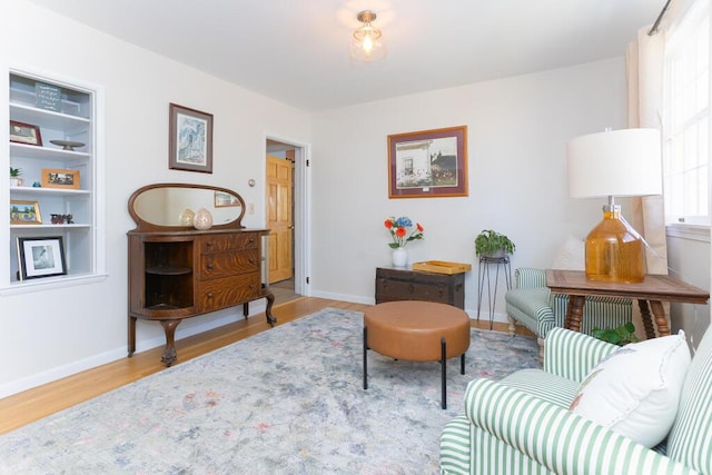 107 Elm St, Farmington, ME 04938 - sitting room with wood finished floors and baseboards