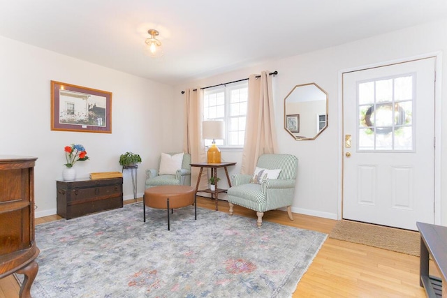 107 Elm St, Farmington, ME 04938 - living area with wood finished floors and baseboards