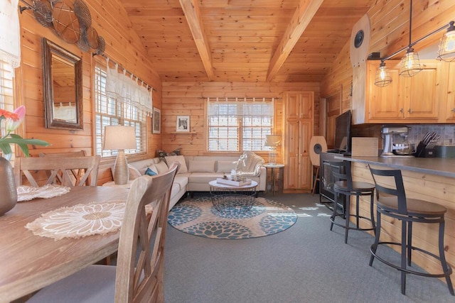 107 Elm St, Farmington, ME 04938 - carpeted dining room with wooden ceiling, wooden walls, and vaulted ceiling with beams