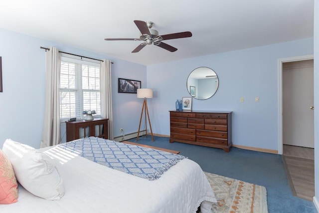107 Elm St, Farmington, ME 04938 - carpeted bedroom featuring baseboards, baseboard heating, and ceiling fan