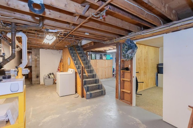107 Elm St, Farmington, ME 04938 - unfinished below grade area featuring stairway and washer / clothes dryer