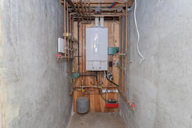 107 Elm St, Farmington, ME 04938 - utility room featuring water heater