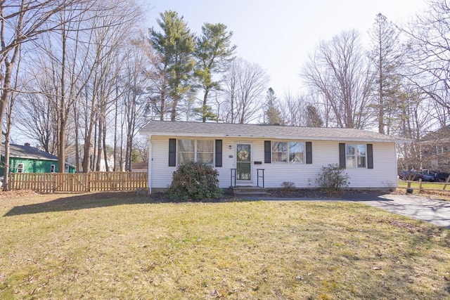 107 Elm St, Farmington, ME 04938 - single story home featuring fence and a front lawn