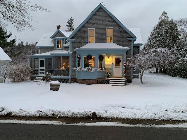 412 N Lubec Rd, Lubec, ME 04652 - view of front facade featuring a chimney and a sunroom