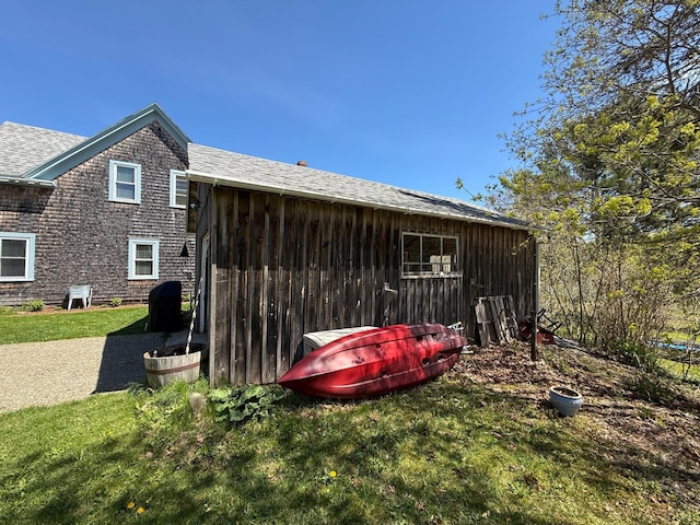 412 N Lubec Rd, Lubec, ME 04652 - view of home's exterior featuring a yard and roof with shingles