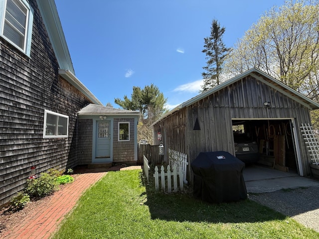 412 N Lubec Rd, Lubec, ME 04652 - view of yard featuring a detached garage, an outbuilding, and gravel driveway