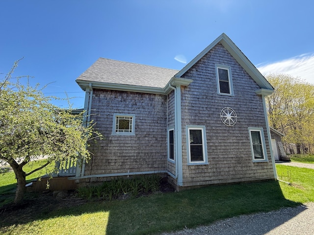 412 N Lubec Rd, Lubec, ME 04652 - view of property exterior with a yard and roof with shingles