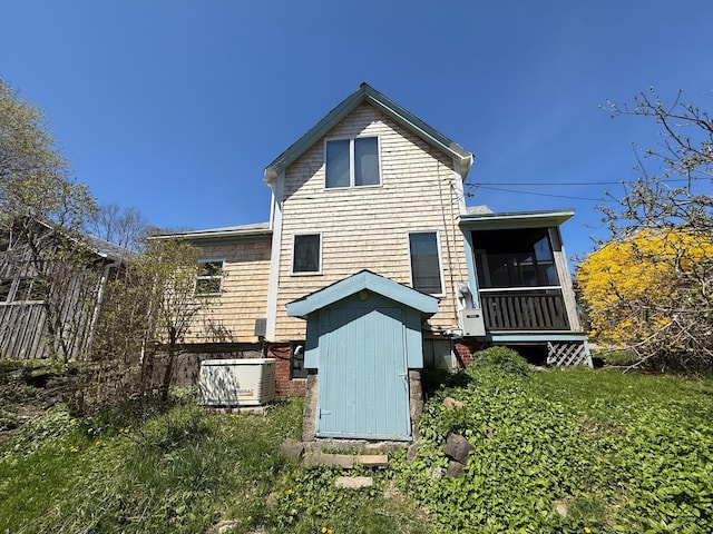 412 N Lubec Rd, Lubec, ME 04652 - rear view of property with a sunroom