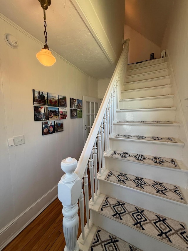 412 N Lubec Rd, Lubec, ME 04652 - stairway featuring wood finished floors, baseboards, and ornamental molding