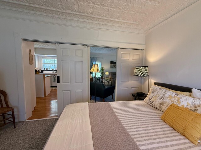 412 N Lubec Rd, Lubec, ME 04652 - bedroom featuring crown molding, a closet, and an ornate ceiling