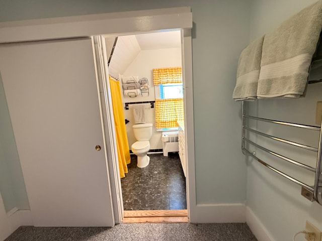 412 N Lubec Rd, Lubec, ME 04652 - bathroom with toilet, a shower with curtain, and baseboards